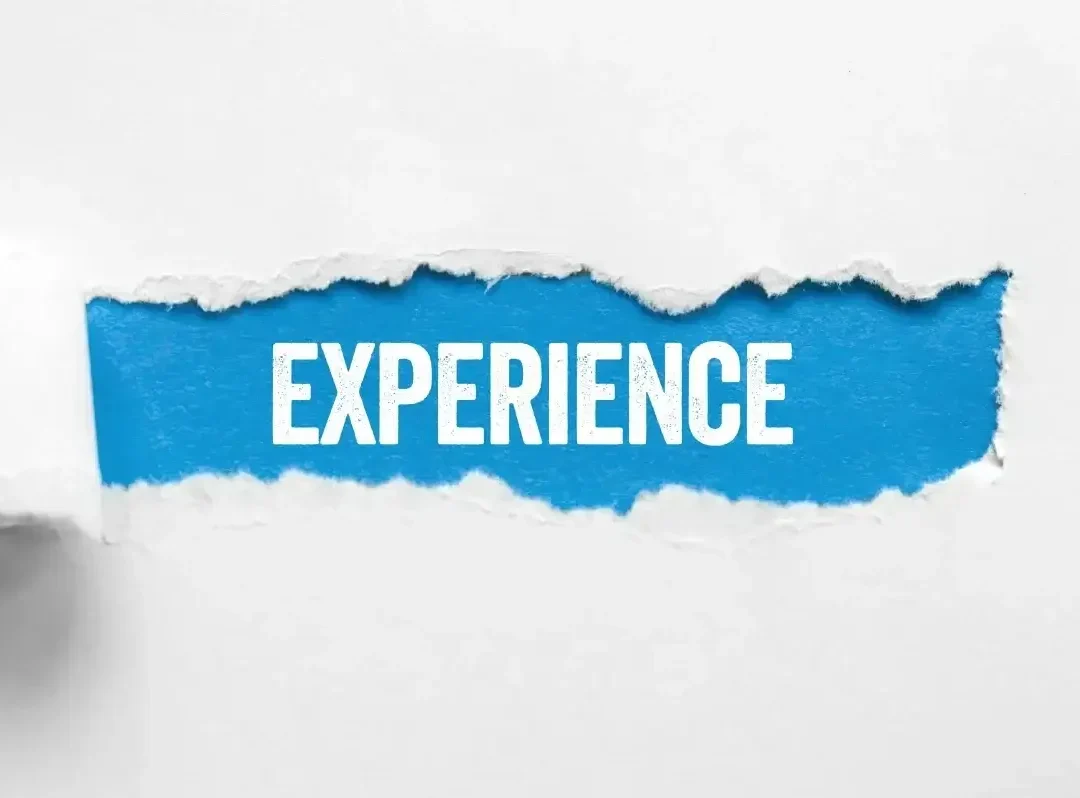 Vintage wooden letterpress blocks spell out the word “EXPERIENCE” across a warm, textured wood surface. The bold, weathered typography evokes timeless craftsmanship – perfectly reflecting Window King’s deep roots, seasoned crews, and hundreds of thousands of Tri-State window installations completed with pride.