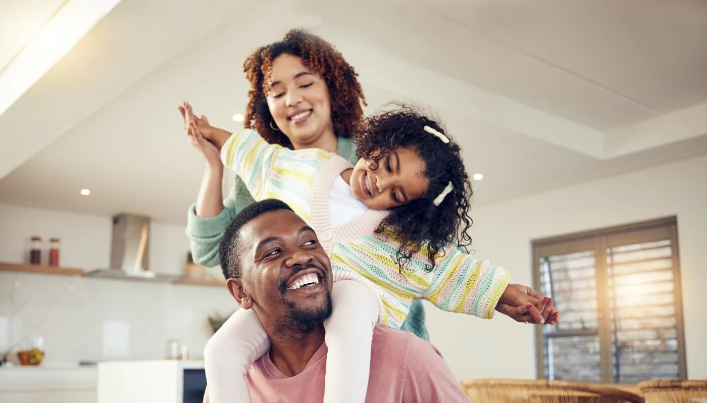 Window & Door Replacement| Window King | NY Metro Happy, comfortable family inside of their NY Metro area home after window replacements by Window King
