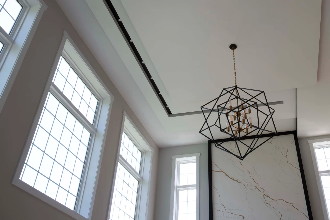 A striking set of OKNA Enviro-Star 800 Series windows installed in a modern, high-ceilinged space. With their sharp, clean lines and energy-efficient glass, these windows flood the room with natural light while maintaining premium thermal performance. Designed for both elegance and endurance, they’re the perfect match for NY Metro homeowners who want top-tier efficiency without sacrificing style