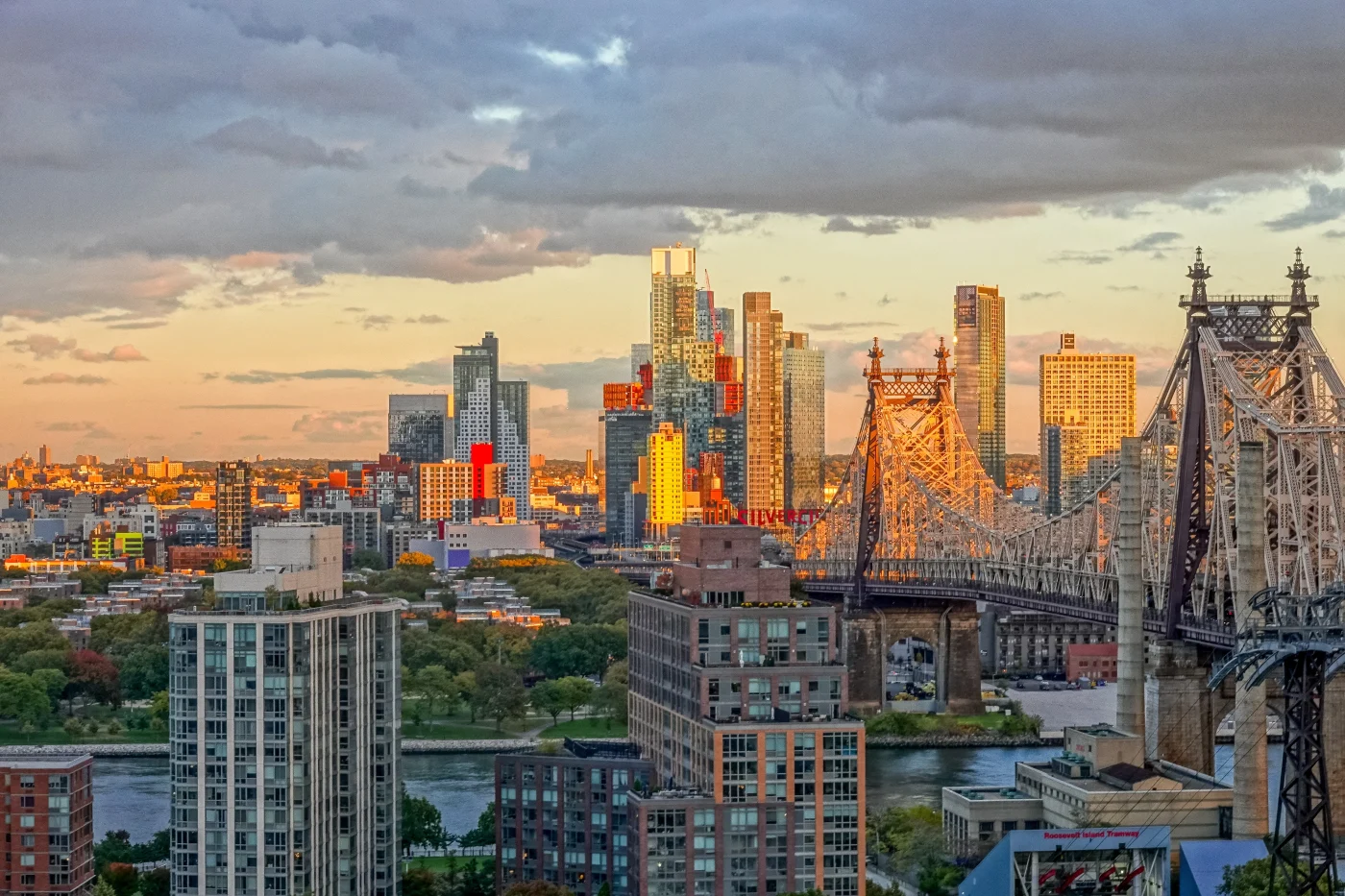 Window King–Three Generations Strong In the Bronx–Rooted In Family A stunning sunset over the East River with the Bronx skyline glowing in warm light. The Queensboro Bridge stretches into view, symbolizing connection, legacy, and resilience—everything Window King stands for. It’s a fitting tribute to three generations of hard work, family pride, and deep community ties in the heart of New York.