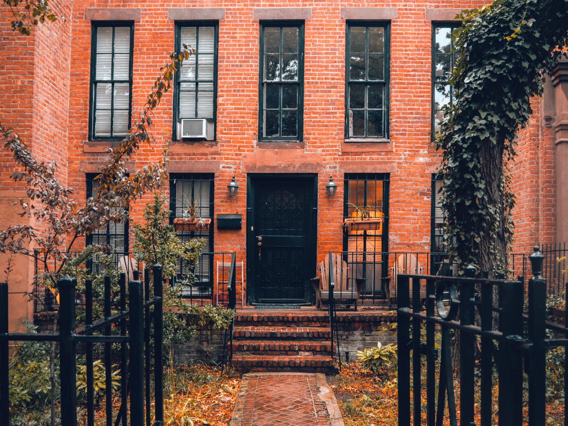 A brownstone with a new entry door.