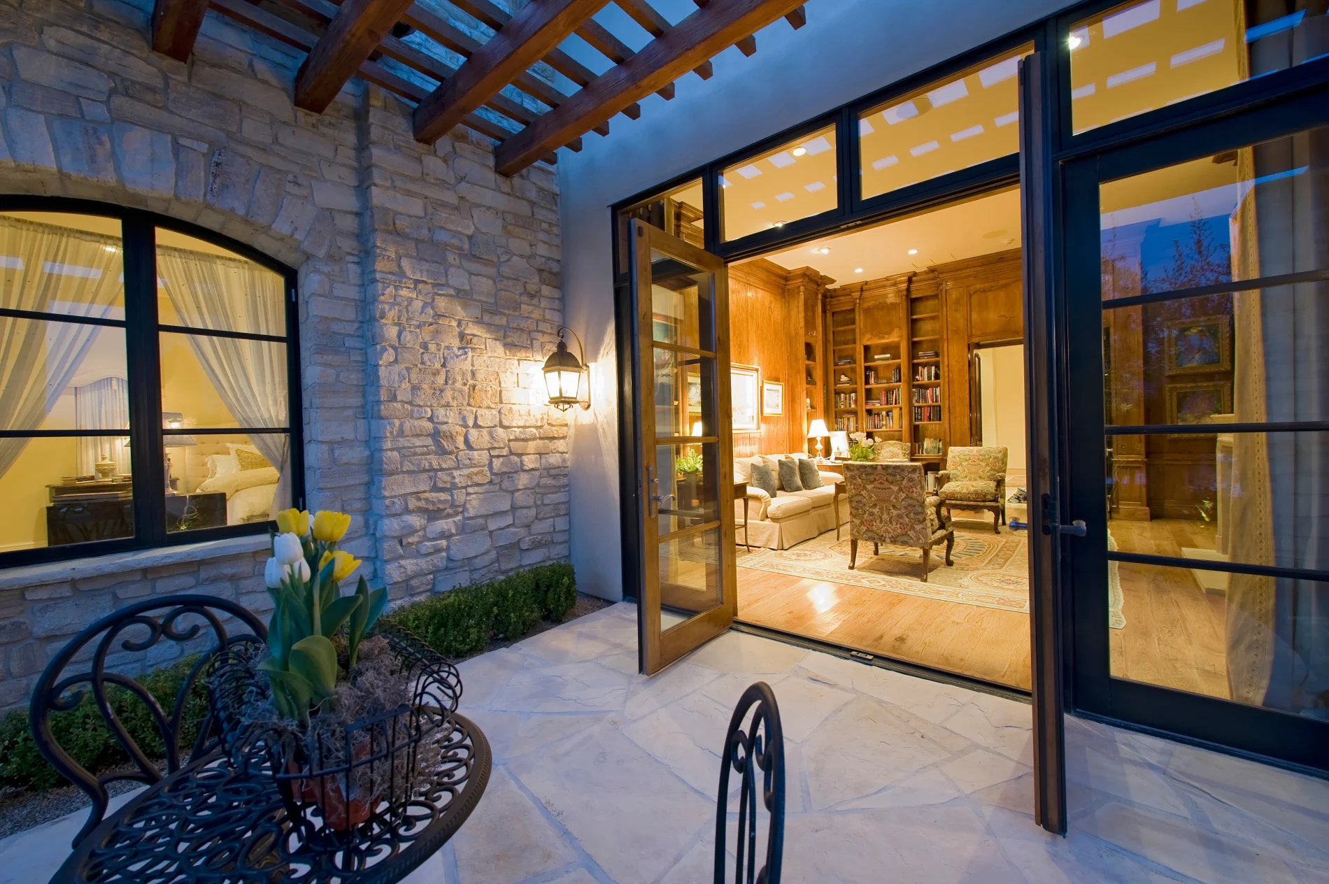 An open patio door leading to an outdoor seating area