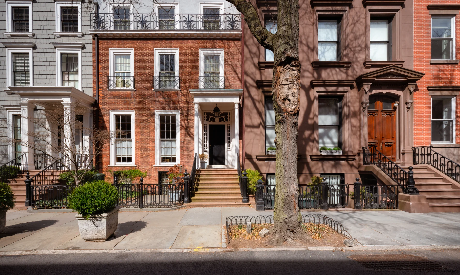 A townhome with a newly installed entry door with sidelights.