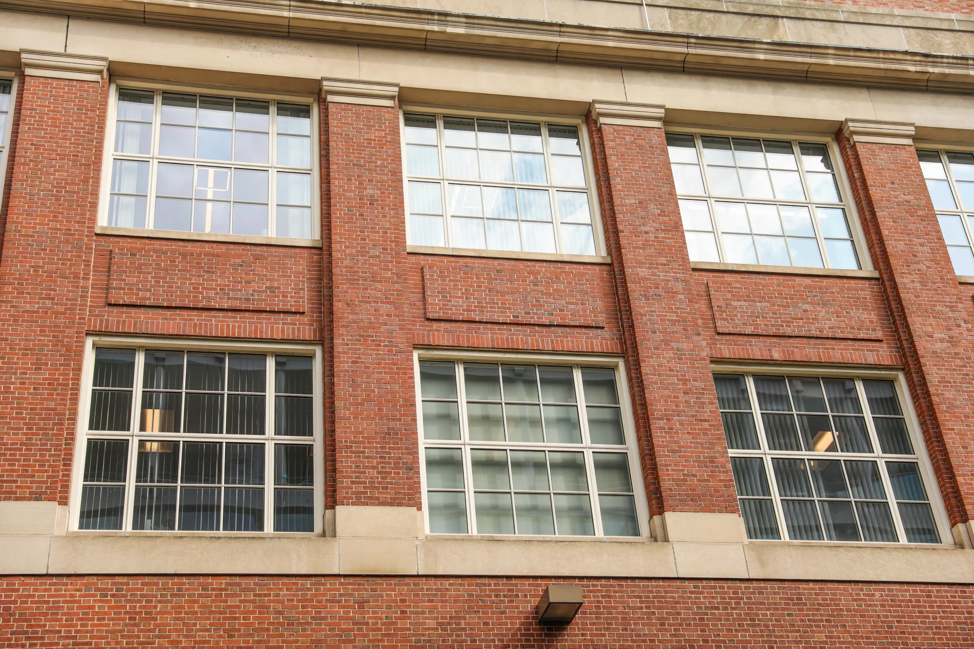Beautiful replacement windows installed on a Yonkers home, featuring crisp frames, clear reflective glass, and enhanced residential curb appeal.