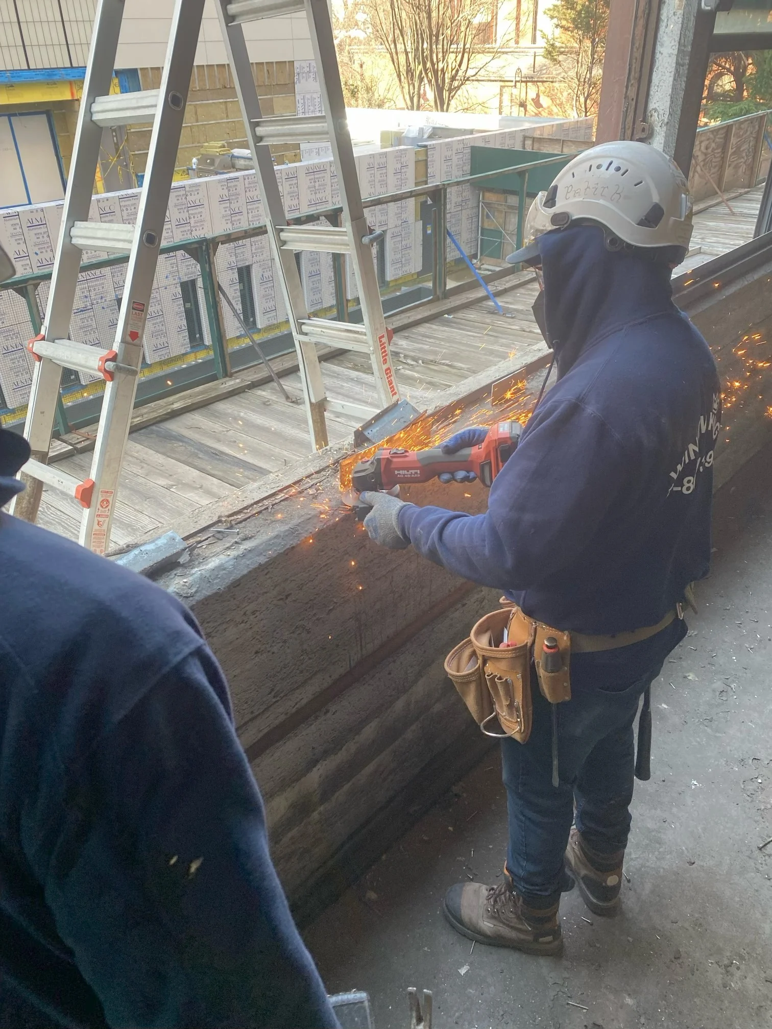 Window Installation Team In Scarsdale, NY Window King installers preparing a window opening before installation.