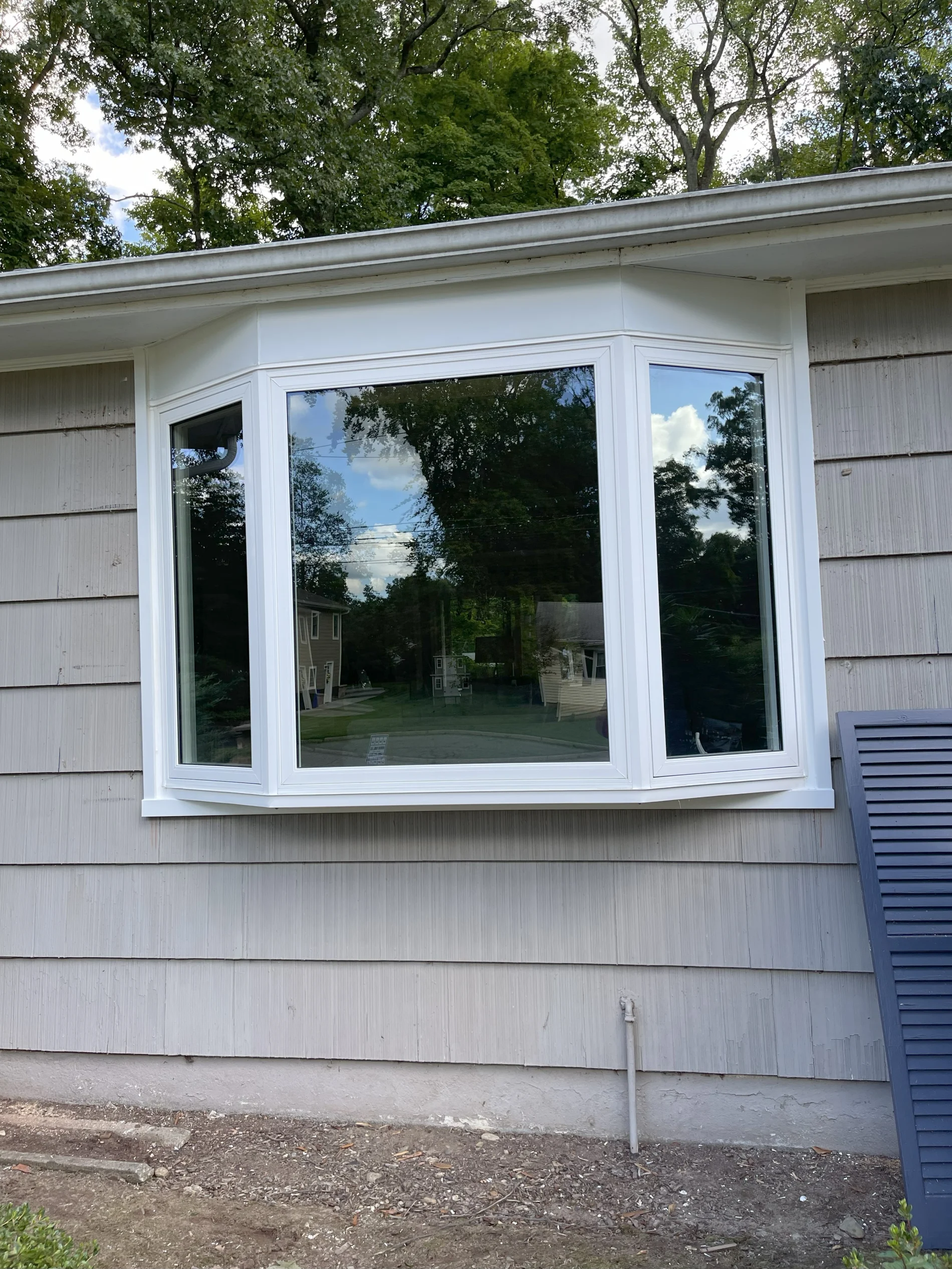 Window Sales In Scarsdale, NY OKNA 700 casement bay window installed by Window King on a residential home.