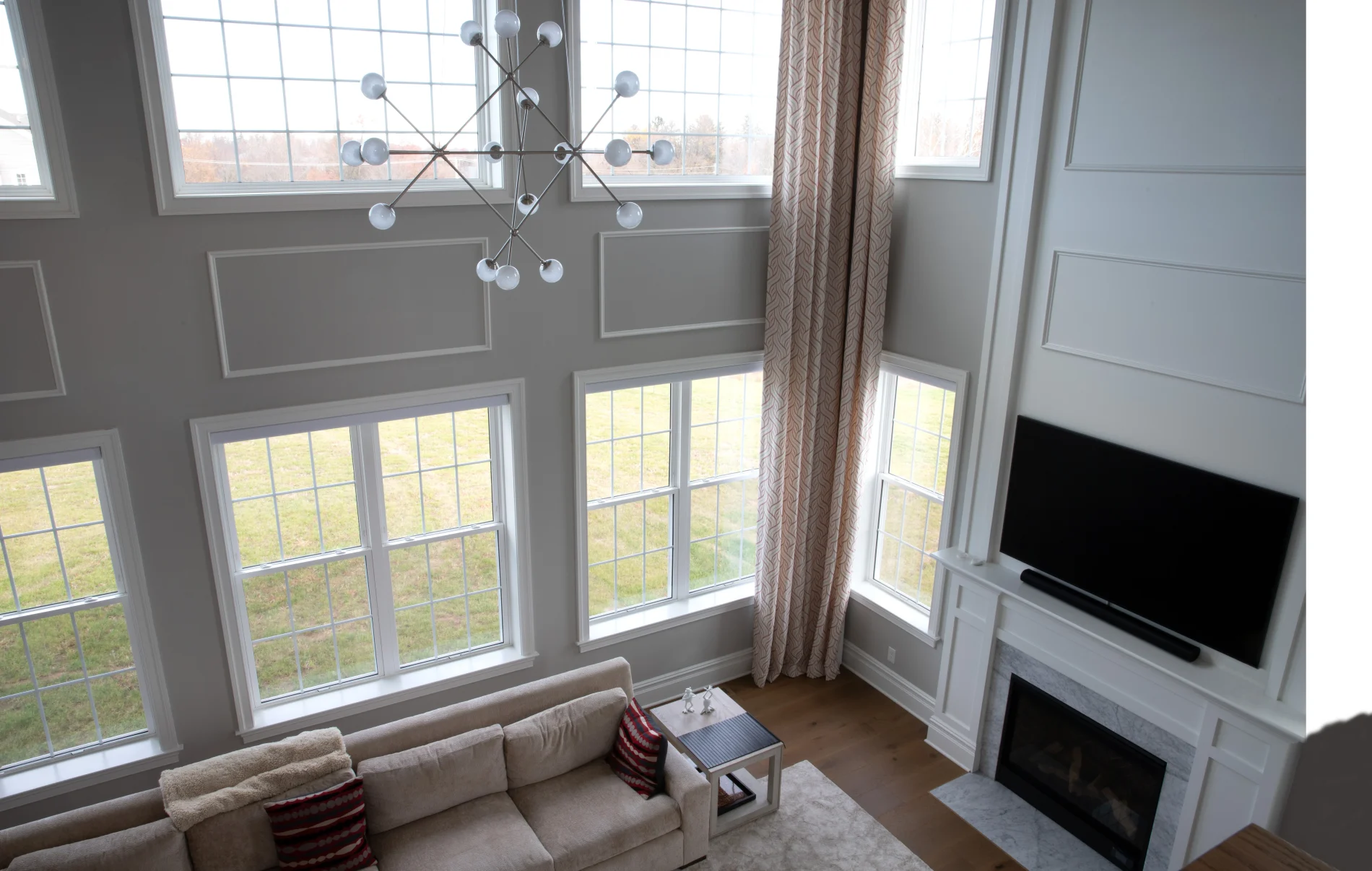 Charming Window Replacement In Hudson, NJ | Window King An interior view of an entire front of windows that have been replaced in a home.